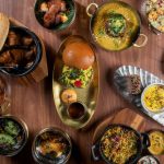 A table of different dishes at Atul Kochhar's Kanishka