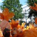 Close-up of beautiful feathers in carnival costumes at the Notting Hill Carnival, London, UK The Notting Hill Carnival is an annual event that has taken place in London since 1966 on the streets of Notting Hill, in the Royal Borough of Kensington and Chelsea, each August over two days (the August bank holiday Monday and the preceding Sunday). It is led by members of the British West Indian community, and attracts around one million people annually, making it one of the world's largest street festivals, and a significant event in Black British culture