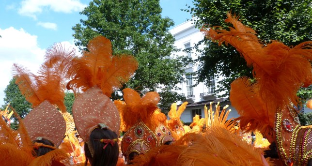 Close-up of beautiful feathers in carnival costumes at the Notting Hill Carnival, London, UK The Notting Hill Carnival is an annual event that has taken place in London since 1966 on the streets of Notting Hill, in the Royal Borough of Kensington and Chelsea, each August over two days (the August bank holiday Monday and the preceding Sunday). It is led by members of the British West Indian community, and attracts around one million people annually, making it one of the world's largest street festivals, and a significant event in Black British culture