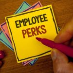 Conceptual hand writing showing Employee Perks. Business photo text Worker Benefits Bonuses Compensation Rewards Health Insurance Text colorful paper notes hand red marker open cap desk letter.