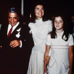 (Original Caption) Bearing traces of confetti, Mr. and Mrs. Aristotle Onassis, (Jackie Kennedy), are shown at their October 20th wedding on Onassis' private island. Caroline Kennedy, 10, stands next to her mother.