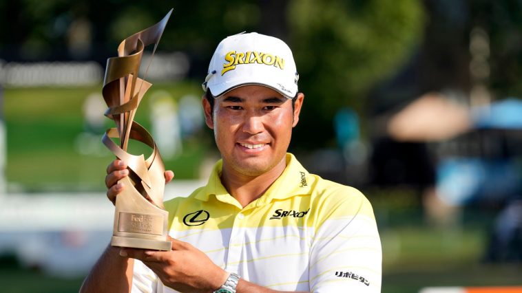 Hideki Matsuyama, of Japan, holds his trophy after winning the St. Jude Championship golf tournament Sunday, Aug. 18, 2024, in Memphis, Tenn. (AP Photo/Mark Humphrey)