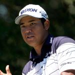 Hideki Matsuyama, of Japan, cleans his driver after hitting his tee shot on the seventh hole during the third round of the St. Jude Championship golf tournament Saturday, Aug. 17, 2024, in Memphis, Tenn. (AP Photo/Mark Humphrey)