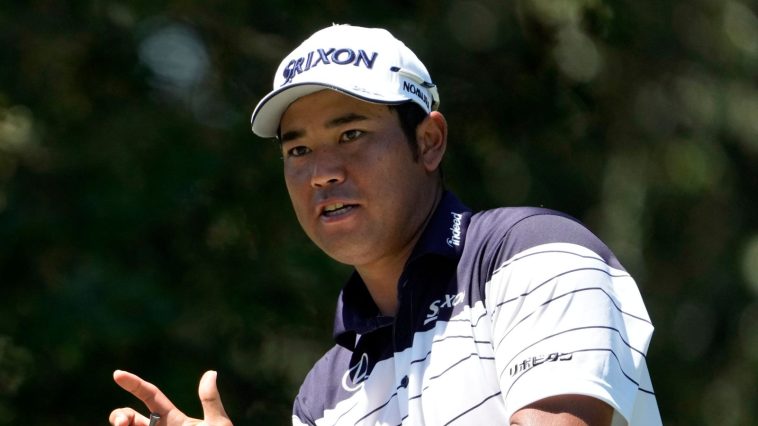 Hideki Matsuyama, of Japan, cleans his driver after hitting his tee shot on the seventh hole during the third round of the St. Jude Championship golf tournament Saturday, Aug. 17, 2024, in Memphis, Tenn. (AP Photo/Mark Humphrey)