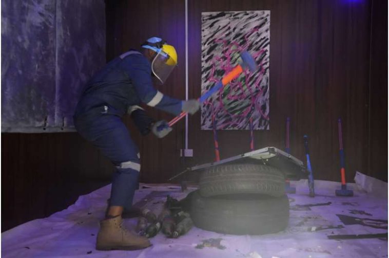 How do you deal with stress? In Nigeria, swinging a sledgehammer in a 'rage room' helps