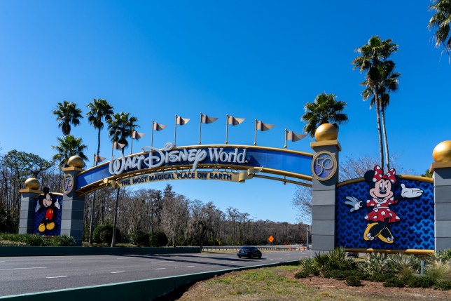 A Walt Disney World entrance arch gate in Orlando, Florida, USA. Walt Disney World is an entertainment resort complex.