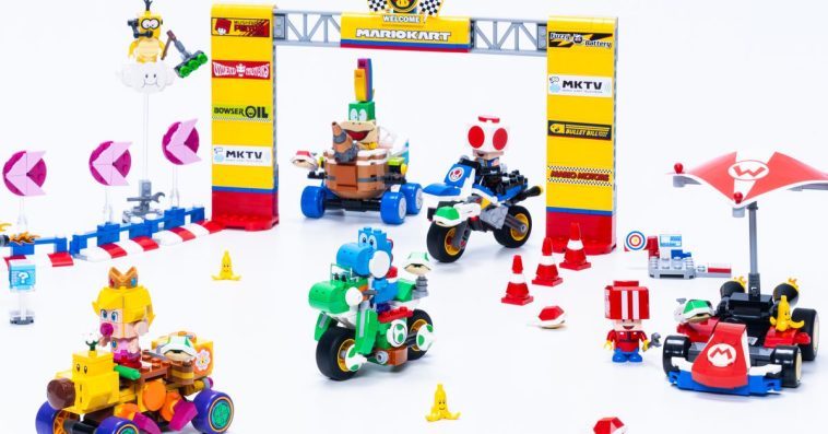 Several Lego Super Mario: Mario Kart vehicles posed against a starting gate.