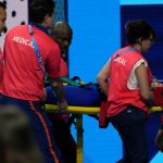 Olympic swimmer collapses after heat race, carried off on stretcher