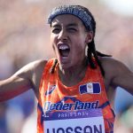 Sifan Hassan, of the Netherlands, celebrates after crossing the finish line to win the gold medal at the end of the women's marathon competition at the 2024 Summer Olympics, Sunday, Aug. 11, 2024, in Paris, France. (AP Photo/Vadim Ghirda)