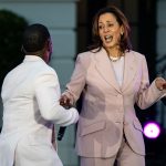 Gospel singer Kirk Franklin dances with U.S. Vice President Kamala Harris as he performs during a concert marking Juneteenth on the South Lawn of the White House on June 10, 2024 in Washington, DC.