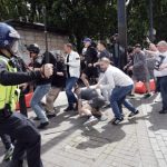 Police clash with right wing demonstrators in Piccadilly Gardens, Manchester, on Saturday.