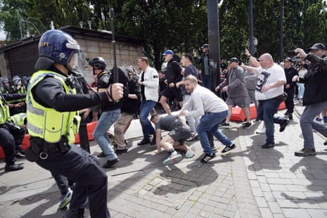 Police clash with right wing demonstrators in Piccadilly Gardens, Manchester, on Saturday.