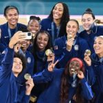 Gold medallists USA pose during the podium ceremony after the women's Gold Medal basketball match between France and the USA during the Paris 2024 Olympic Games at the Bercy  Arena in Paris on August 11, 2024. (Photo by Damien MEYER / AFP) (Photo by DAMIEN MEYER/AFP via Getty Images)