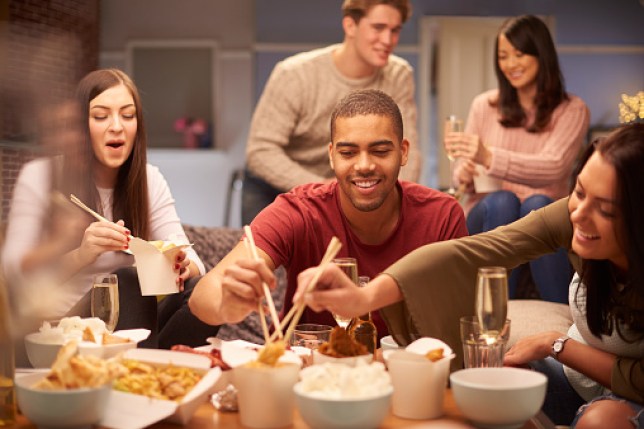 Group of friends eating a chinese takeaway