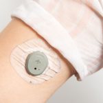 Closeup of someone wearing Dexcom Stelo CGM