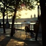 Summer evening on South bank of river Thames London.