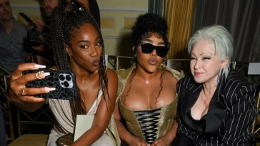 Tiffany Haddish, Lil' Kim and Cyndi Lauper at the Christian Siriano Spring 2025 ready-to-wear show.