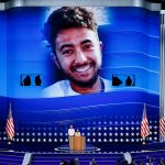 An image of Hersh Goldberg-Polin is displayed as his parents Jon Polin and Rachel Goldberg speak on stage during the third day of the 2024 DNC.