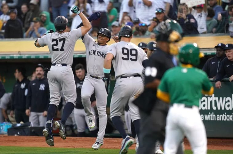 Sep 21, 2024; Oakland, California, USA; New York Yankees designated hitter Giancarlo Stanton (27) is congratulated by right fielder Juan Soto (22) after hitting a three-run home run against the Oakland Athletics in the third inning at the Oakland-Alameda County Coliseum. Mandatory Credit: Cary Edmondson-Imagn Images