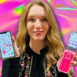 Courtney holding her iPhone in one hand and Barbie flip phone in the other, with a pink background