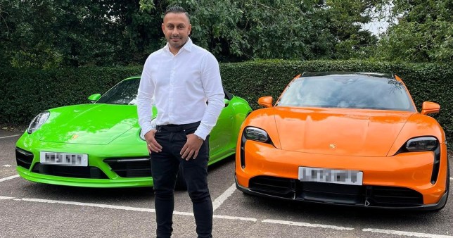 Mindy standing in front of his two Porsche's - green and orange