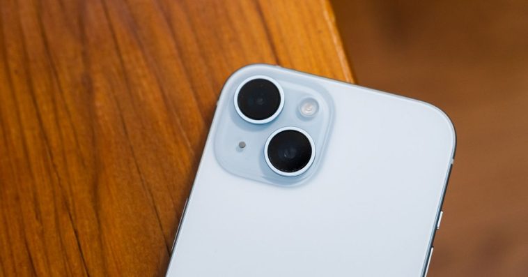 iPhone 15 in blue showing camera bump.