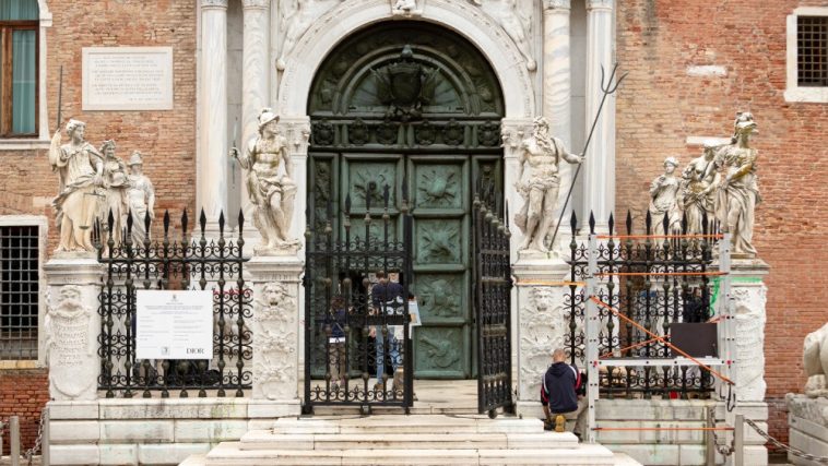 Restorers working on the Porta Magna in Venice