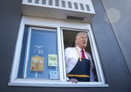 Donald Trump handing out food at a drive-thru window during a campaign stop at McDonald's on Oct. 20, 2024.