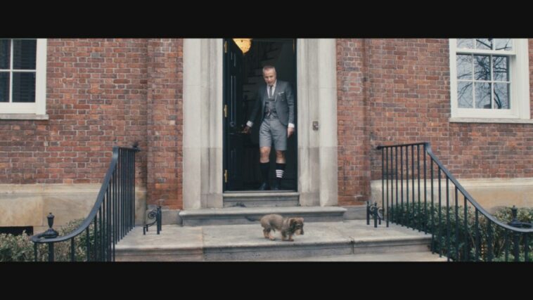 In a still from the film, Thom Browne and his dog Hector leave their home.