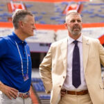 Sep 14, 2024; Gainesville, Florida, USA; Florida Gators athletic director Scott Stricklin (left) and head coach Billy Napier talk before a game against the Texas A&M Aggies at Ben Hill Griffin Stadium. Mandatory Credit: Matt Pendleton-Imagn Images