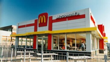 A McDonalds Drive-Thru in Cardiff, Wales in the 1990s, with white exterior, red detailing and the famous yellow 'M'