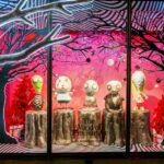 Sculptures from Tim Burton's private collection are featured in one of the British retailer's Christmas windows.