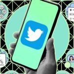 Hand holding phone with Twitter logo against an illustrated background