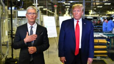 US President Donald Trump (r) and Apple CEO Tim Cook speak to the press during a tour of the Flextronics computer manufacturing facility where Apple’s Mac Pros are assembled in Austin, Texas, on November 20, 2019.