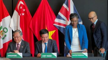 Singapore and Vietnam trade ministers alongside UK Conservative leader Kemi Badenoch during the signing of the deal for the UK to join the CPTPP in New Zealand last year