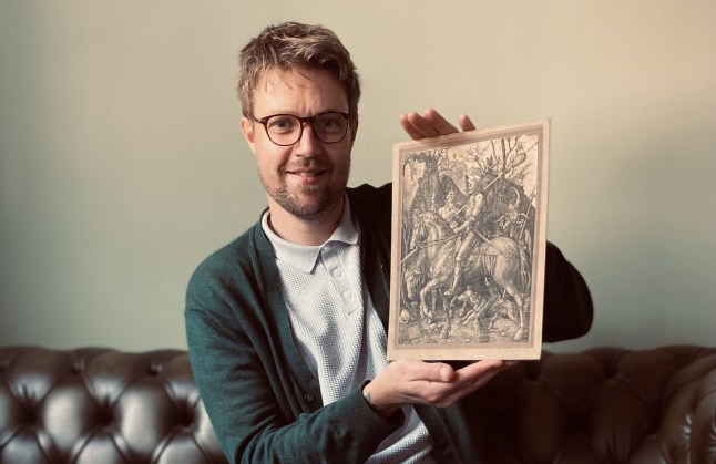 WORDS BYLINE: MARK WORGAN Mat Winter, 24, was 11 years old when he came across a find that would change his life more than a decade later - a spectacular engraving by one of the Renaissance???s most revered artists. One which has now sold for ??26,500. As a childhood hobby, Mat created his own ???antique shop??? in his aunt???s garden shed. While looking for trinkets he could use as stock he visited his local tip in Cranbrook, Kent to seek out interesting finds others had overlooked. There a woman gave him a mysterious engraving featuring an armoured knight on a horse, accompanied by his dog, riding past a goat-headed devil and the figure of death. Mat explains: ???Aged 11 at the local tip there were about six or seven cars, then this lady opened her car boot up and she had bits of rubbish in it. I saw the picture and I said, ???Can I have it???? She said, ???Of course. You???re welcome to it.??? I thought I could be the person to save it. I???ve always liked old stuff. ???It looked so interesting to me. So I took it back to my shed where I had a little antiques shop with some other items in there,??? he continues. ???I kept it all those years, all the time I???ve looked after it How it is now is how I got it. The day I got it I put it up on my shed wall. It was the main item I always thought was special in my shed.??? After more than a decade, Mat, who still lives nearby in Cranbrook, had a clearout of some of his prized keepsakes, but decided to take his collection???s centrepiece to art expert Jim Spencer, Director of Rare Book Auctions in Lichfield. ???All them years I had it and it was just sitting there in my shed,??? he remembers. ???The shed???s now gone and the things are in the container - which is why I got rid of a lot. Some stuff I???ve got rid of as it was taking up too much space - but that always stuck with me as I thought it was something special.??? Jim was astonished by what he saw - an original version of Knight, Death and the Devil, a 500-year-old engraving by Albrecht D??rer. D??rer was a painter and printmaker who was a contemporary of Raphael and Leonardo Da Vinci and is regarded as one of the most gifted artists of all time. Mat said he took it to Jim to ???see if it was as special as I thought it was??? and now his faith has been rewarded - as the engraving ultimately sold at auction for ??26,500 at auction on Wednesday. Mat, who is currently not in work, sat watching the online auction of the artwork full of excitement - as the bidding on his incredible find ticked up past ??10,000 and eventually up to ??26,500 when the hammer came down. He is blown away by the end result. ???It???s amazing,??? the unexpected art aficionado, who was completely unaware of his find???s significance for all the time it sat in his shed, explains. ???I???m over the moon. It???s all a gift. I???m a bit in shock. I???m just overwhelmed with it all.??? As for what he plans to spend the money on - he will have a bit of a celebration, but his main aim is to get a smart set of wheels. ???It will go towards a car, my favourite dream car would probably be a Rolls-Royce,??? he reveals - though he may set his sights on a more practical getaround. The remarkable find was also a delight to art expert Jim, who was taken aback by what he saw when Mat brought the D??rer in. Describing the moment he laid eyes on the artwork, he gushes: ???I opened the package, removed the bubble wrap, and staggered back in awe. My hands were shaking as I held it up to the light. ???The laid paper was absolutely right for the period. The quality of the engraving was exceptional beyond words. I knew that only one person could've produced something like this - it had to be the hand of D??rer himself. "I shouted over to my brother - and colleague - Matty. He came over and agreed with me instantly, it was simply too good to have been engraved by anyone else.??? Jim then took the print to the British Museum where with assistance from experts, they checked it in fine detail and it was authenticated the real thing! The expert and auctioneer says it is ???the most important print??? he???s ever offered for sale - and if it had not been pasted on to a mount around 100 years ago, the print may have sold for as much as ??200,000. Despite his remarkable find, Mat has no plans to use the keen eye he demonstrated as a child to set himself up as an art collector. ???I???m not going to become an art expert,??? he adds. ???Much as I???d love to I haven???t got the room for it.??? He says he is still just too ???in shock??? by such a lifechanging moment to consider the future - but regards his good fortune as a ???gift???. One he???ll treasure forever - especially when he???s driving his new car. Where: Cranbrook, Kent, United Kingdom When: 10 Sep 2024 Credit: Rare Book Auctions/Cover Images **All usages and enquiries, please contact info@cover-images.com - +44 (0)20 3397 3000EDITORIAL USE ONLY. MATERIALS ONLY TO BE USED IN CONJUNCTION WITH EDITORIAL STORY. THE USE OF THESE MATERIALS FOR ADVERTISING, MARKETING OR ANY OTHER COMMERCIAL PURPOSE IS STRICTLY PROHIBITED. MATERIAL COPYRIGHT REMAINS WITH STATED SUPPLIER.**