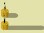 The illustration shows a man and a woman standing on separate stacks of coins.