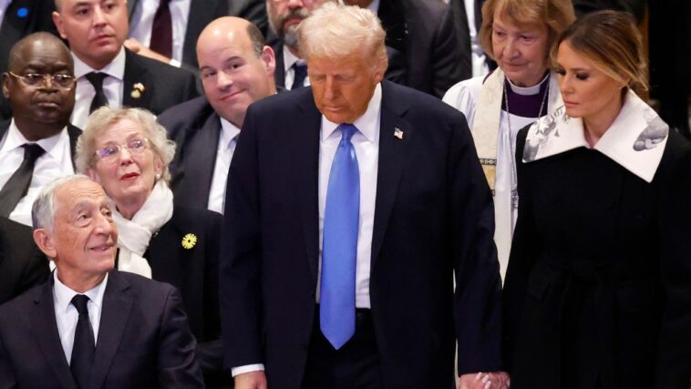 WASHINGTON, DC - JANUARY 09: U.S. President-elect Donald Trump and Melania Trump arrive for the state funeral for former U.S. President Jimmy Carter at Washington National Cathedral on January 09, 2025 in Washington, DC. President Joe Biden declared today a national day of mourning for Carter, the 39th President of the United States, who died at the age of 100 on December 29, 2024 at his home in Plains, Georgia. (Photo by Chip Somodevilla/Getty Images)