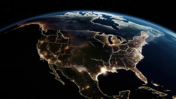 A nighttime view of the United States from space, showing illuminated urban areas and dark rural regions, symbolizing broadband connectivity gaps and efforts to bridge the digital divide.