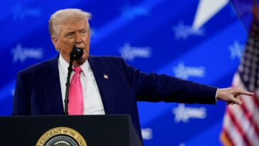 Trump revels in mass federal firings and jeers at Biden before adoring conservative crowd